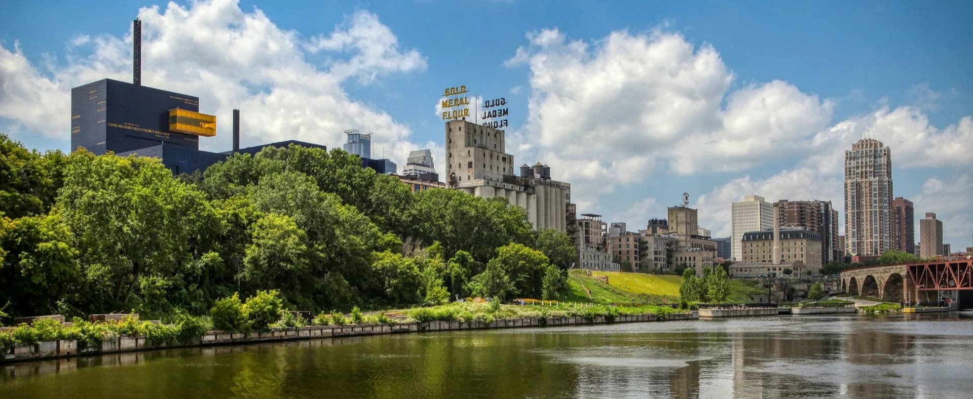 The Minneapolis skyline seen across the river on a bright day